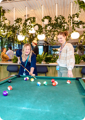 Photo of staff members playing pool in the 2degrees office